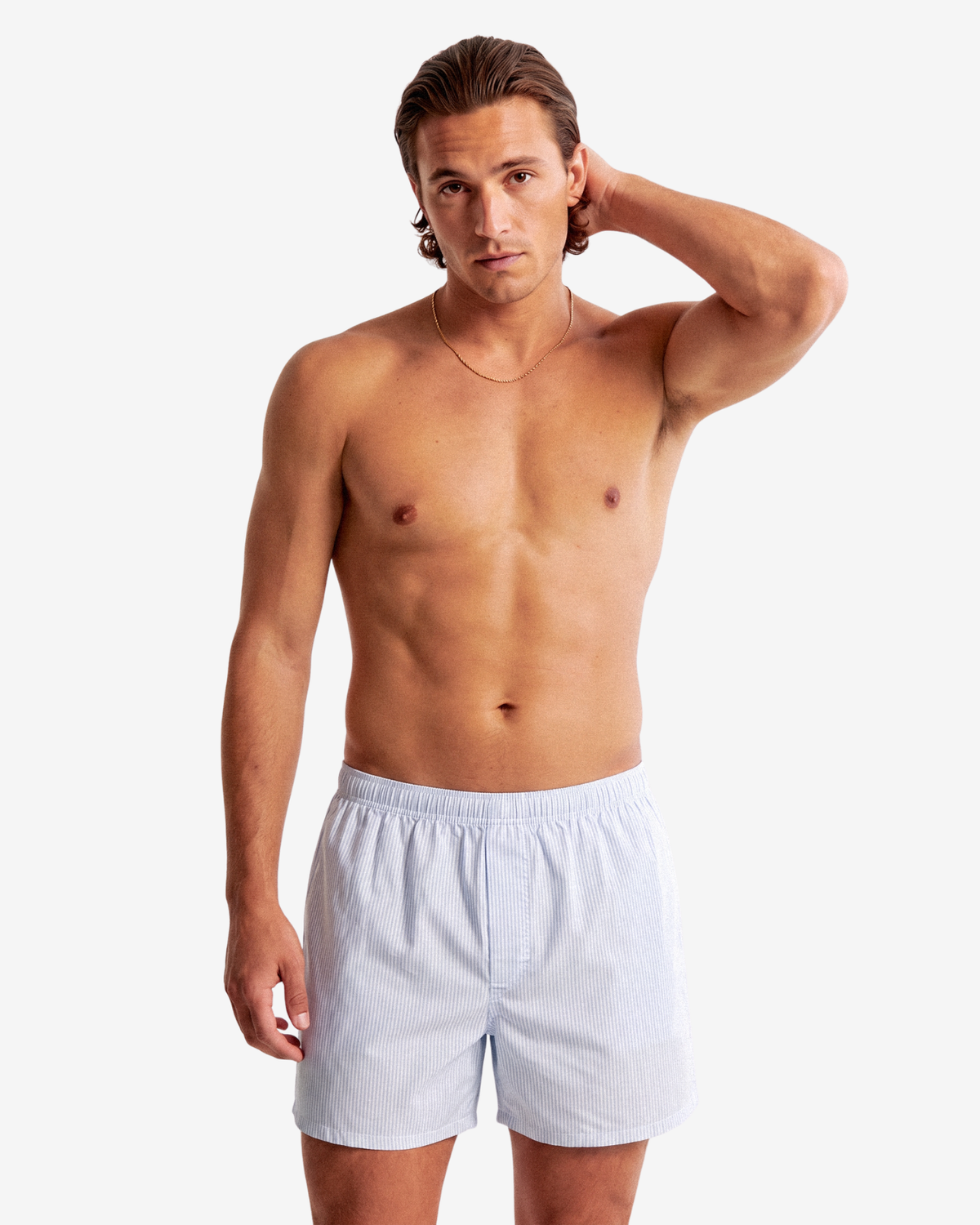 Model with a hand behind his head wearing Son of John Light Blue Pinstripe boxer shorts
